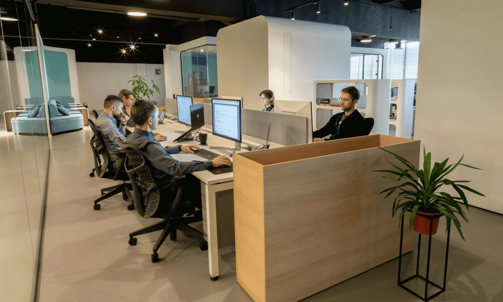 radon mitigation in commercial building with a team of employees working at their cubicles