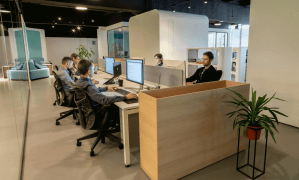 radon mitigation in commercial building with a team of employees working at their cubicles